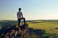 Young man on top of rock Royalty Free Stock Photo