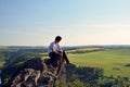 Young man on top of rock Royalty Free Stock Photo