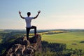 Young man on top of rock Royalty Free Stock Photo