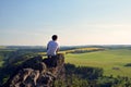 Young man on top of rock Royalty Free Stock Photo