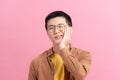 Young man touching his face and closing eyes with expression of horrible suffer from health problem and aching tooth Royalty Free Stock Photo