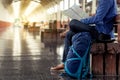 Young man tourist with backpack at the train station in town Royalty Free Stock Photo