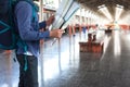 Young man tourist with backpack at the train station in town Royalty Free Stock Photo