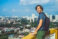 Young man tourist in Buddhist temple Kek Lok Si in Penang, Malaysia, Georgetown Royalty Free Stock Photo