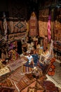 Young man tourist at an old traditional Turkish carpet shop in cave house Cappadocia, Turkey Kapadokya Royalty Free Stock Photo