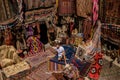 young man at an old traditional Turkish carpet shop in cave house Cappadocia, Turkey Kapadokya Royalty Free Stock Photo