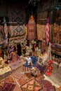 young man at an old traditional Turkish carpet shop in cave house Cappadocia, Turkey Kapadokya Royalty Free Stock Photo