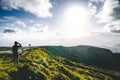 Young man tourist overlooking Beautiful panoramic view of Lagoa do Fogo, Lake of Fire, in Sao Miguel Island, Azores