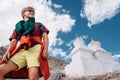 Young man tourist portrait with buddhist holy stupas on background