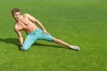 Young man training on green grass Royalty Free Stock Photo