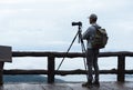 Young man travel photographer taking nature photo of mountain landscape Thailand Royalty Free Stock Photo