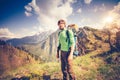 Young Man Traveler relaxing outdoor with mountains on background