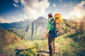 Young Man Traveler relaxing outdoor with mountains on background