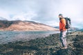 Young man traveler stay on the mountain lake cost