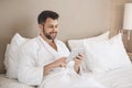 Young man traveler tourist hotel room accomodation Royalty Free Stock Photo