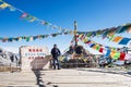 Young man traveler traveling at Shika Snow Mountain or Blue Moon Valley in Zhongdian city Shangri-La. Yunnan, China. Chinese Royalty Free Stock Photo