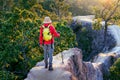 Young man trekking along Pai canyon in Mae hong son province, Thailand. Adventure, trekking and trail concept