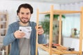 young man tries himself to fold bookcase Royalty Free Stock Photo
