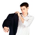 Young man try on black jacket isolated on white background Royalty Free Stock Photo