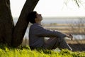 Young man turns to God with hope, the concept of faith and spirituality Royalty Free Stock Photo