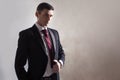 Young man in a tuxedo with tie. Is adjusting his jacket Royalty Free Stock Photo