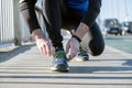 Young man tying laces of running shoes before training,closeup on shoe Royalty Free Stock Photo