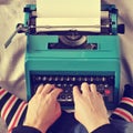 Young man typewriting, with a retro effect Royalty Free Stock Photo