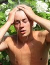 Young man under a shower Royalty Free Stock Photo