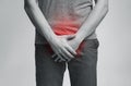 Young man with urological problems suffering from pain