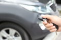 Young man using car alarm system Royalty Free Stock Photo