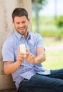 Young man using cell phone Royalty Free Stock Photo