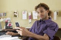 Young man Using Cellphone In Office Royalty Free Stock Photo