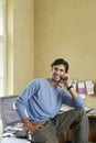 Young man Using Cellphone In Office Royalty Free Stock Photo