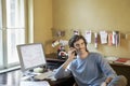 Young man Using Cellphone In Office Royalty Free Stock Photo