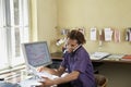 Young man Using Cellphone In Office Royalty Free Stock Photo