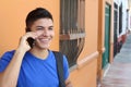 Young man using cellphone outdoors Royalty Free Stock Photo