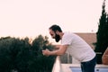 Young man using a chat app in his forest house Royalty Free Stock Photo