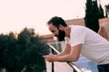 Young man using a chat app in his forest house Royalty Free Stock Photo