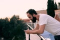 Young man using a chat app in his forest house Royalty Free Stock Photo