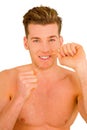 Young man using dental floss Royalty Free Stock Photo