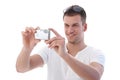 Young man using digital camera smiling Royalty Free Stock Photo