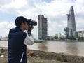 A young man using DSLR to take pictures Royalty Free Stock Photo