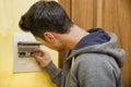 Young man using an electronic control panel