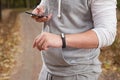 Young man using fitness bracelet during