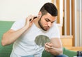 Young man using hair trimmer Royalty Free Stock Photo