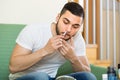 Young man using hair trimmer Royalty Free Stock Photo