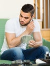 Young man using hair trimmer Royalty Free Stock Photo