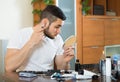 Young man using hair trimmer Royalty Free Stock Photo