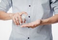 Young man using hand sanitizer or alcohol gel for washing hands, Corana virus or Covid-19 prevention, Hygiene concept.