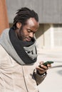 Young man using his phone Royalty Free Stock Photo